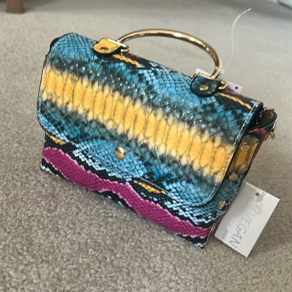 - - Cross body new bag, good for any occasion.